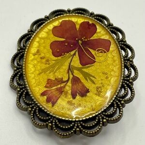 Vintage Pressed Flower in Resin Brooch with a Decorative Frame. Red and Gold